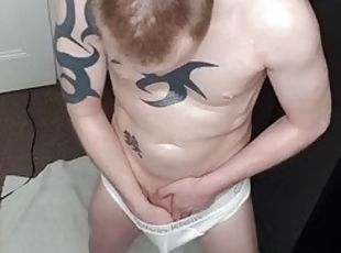 Oiled ginger handjob and cum