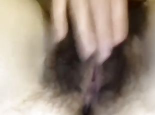 Close up of girl playing with massive hairy bush