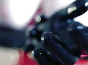 Arya Grander in red latex with black latex rubber long glove