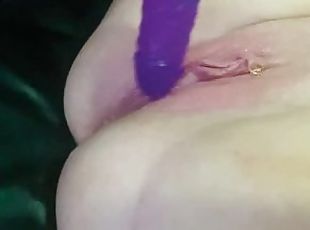 squirting on the couch with my purple dildo