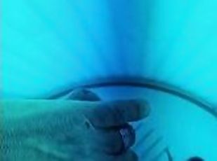 Jerking off in the tanning booth. Hard cock