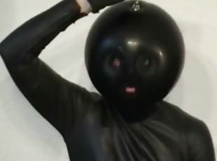 Latex Catsuit Girl With Black Rubber Ballhood Masturbates With Her Pussy