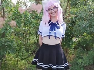 Sexy schoolgirl with ears in uniform walks down the abandoned road