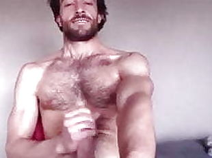 Bearded guy wanks on webcam