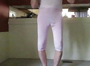 Crossdresser in tight pink shows his sissy ass and bulge.