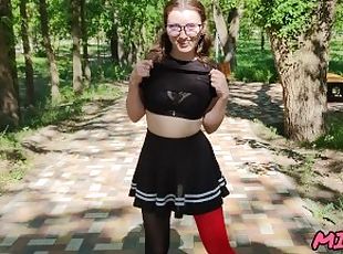 cute schoolgirl in glasses and stockings skips class while walking in central park