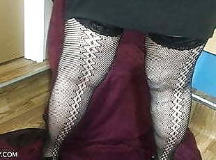 Old granny in her slutty skirt and fishnet stockings