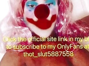 Sexy clown shows off huge tits on slide show