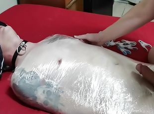 Mistress Wraps Her Slave In Clingwrap