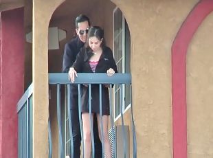 Babe shows tits and pussy on the balcony