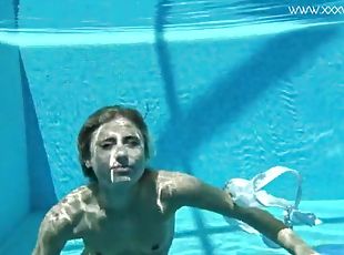 Hot American blonde Lindsay Cruz swims naked in the pool