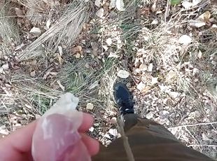 Young horny twink found a used condom in the woods, so he put his cock in it and spermed