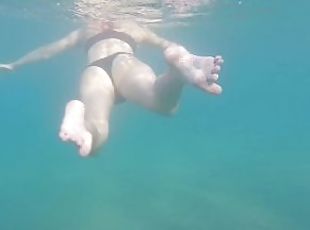 Aquatica's feet melted in the blue sea